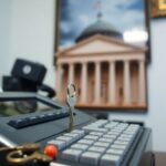 Bail bonds office with cash register and courthouse photo.